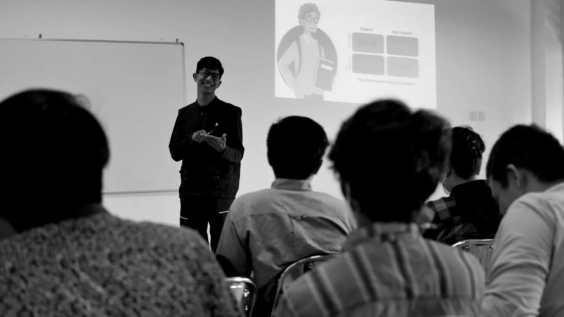 A trainer presenting to a group of participants