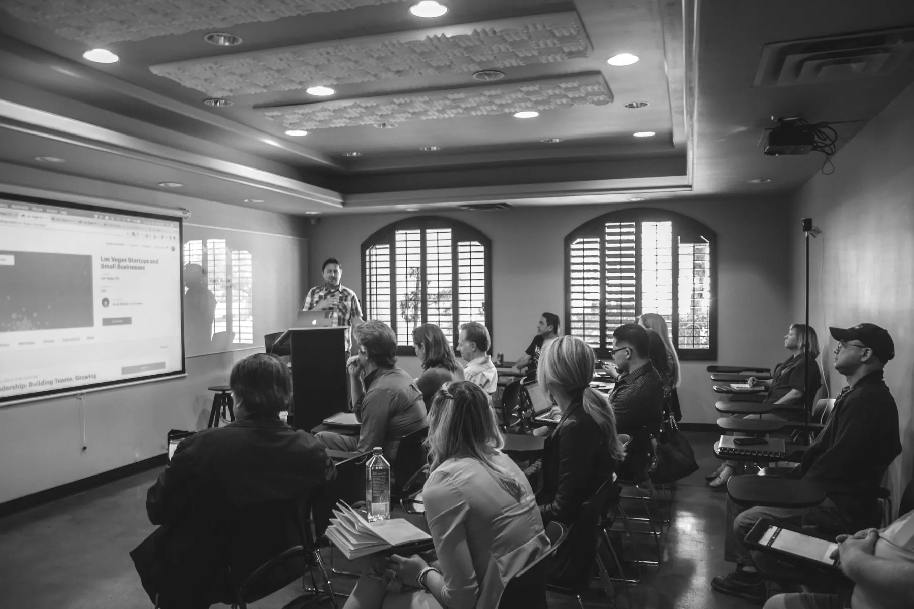 A workshop in a meeting room with a projector